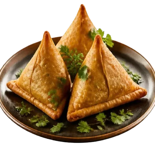 Three golden samosas on a dark plate with coriander
